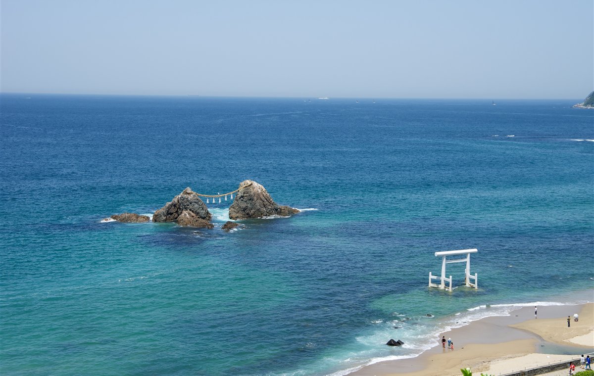 White torii gate and Couple Rock at Sakurai Futamigaura in Itoshima, Fukuoka